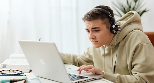 A young UK student preparing for the 11 Plus exam with a tutor